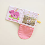 Interactive fabric photo album for babies featuring hidden picture pockets and cute animal designs