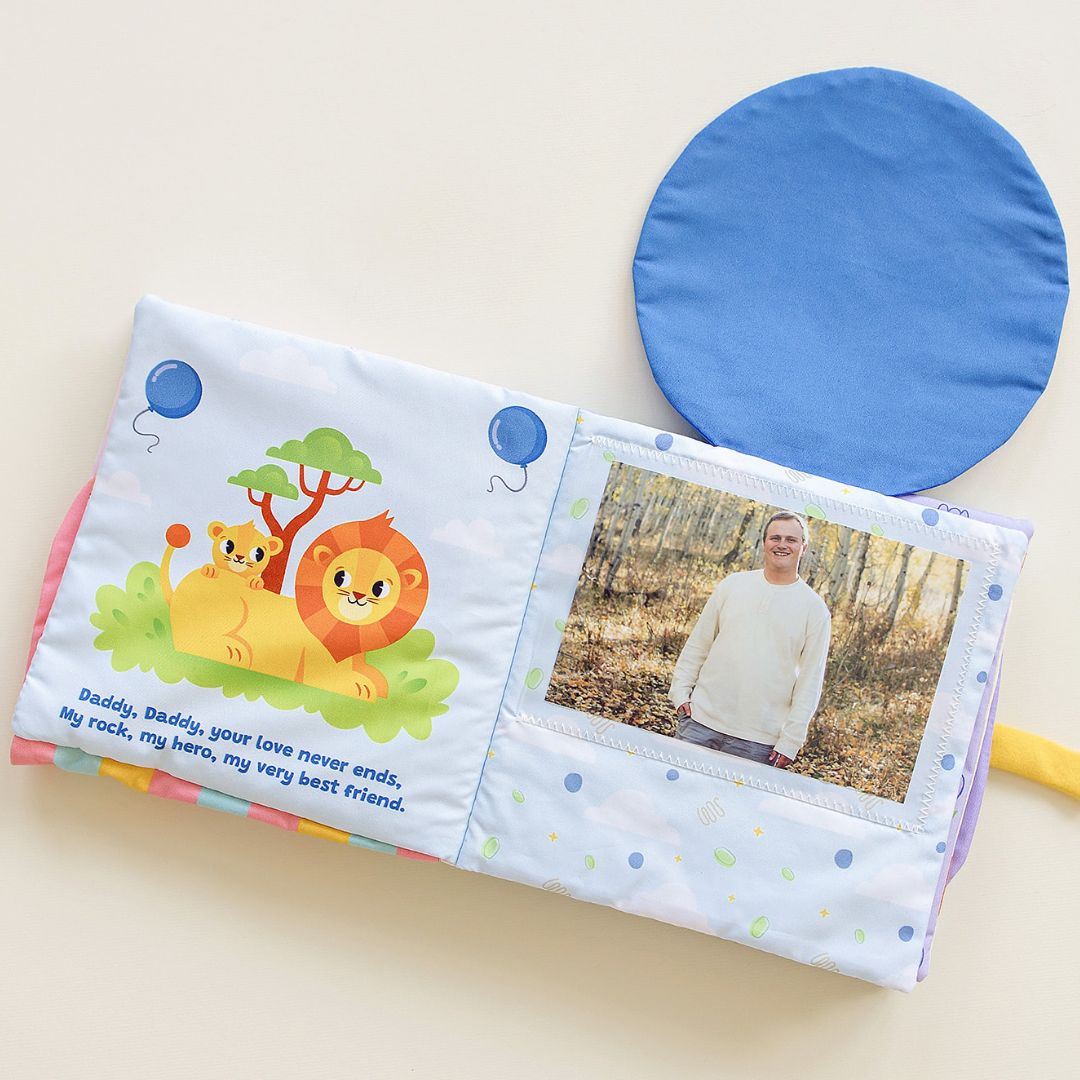 Soft cloth lift-the-flap book featuring father and child with hidden photo pocket