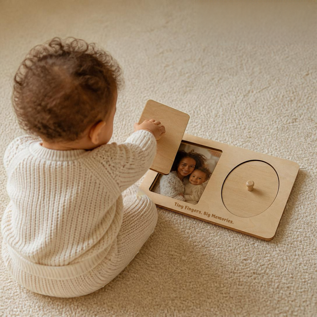 Baby lifting lid to find photo of mama in his peekaboo puzzle