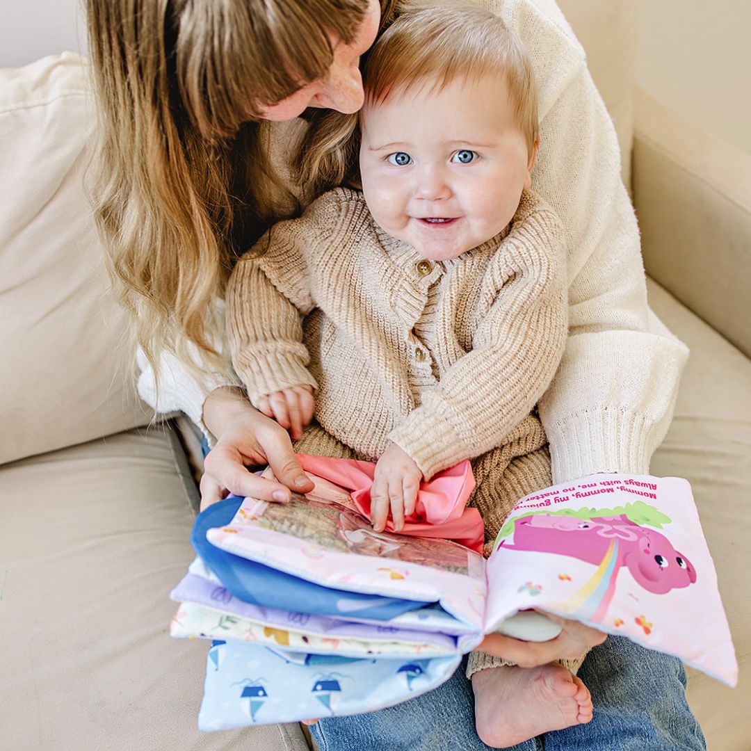 Mother and baby reading Peek-A-Photo's interactive lift-the-flap books together during storytime